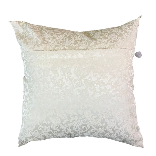 Backside of the cushion that has floral design and a zip