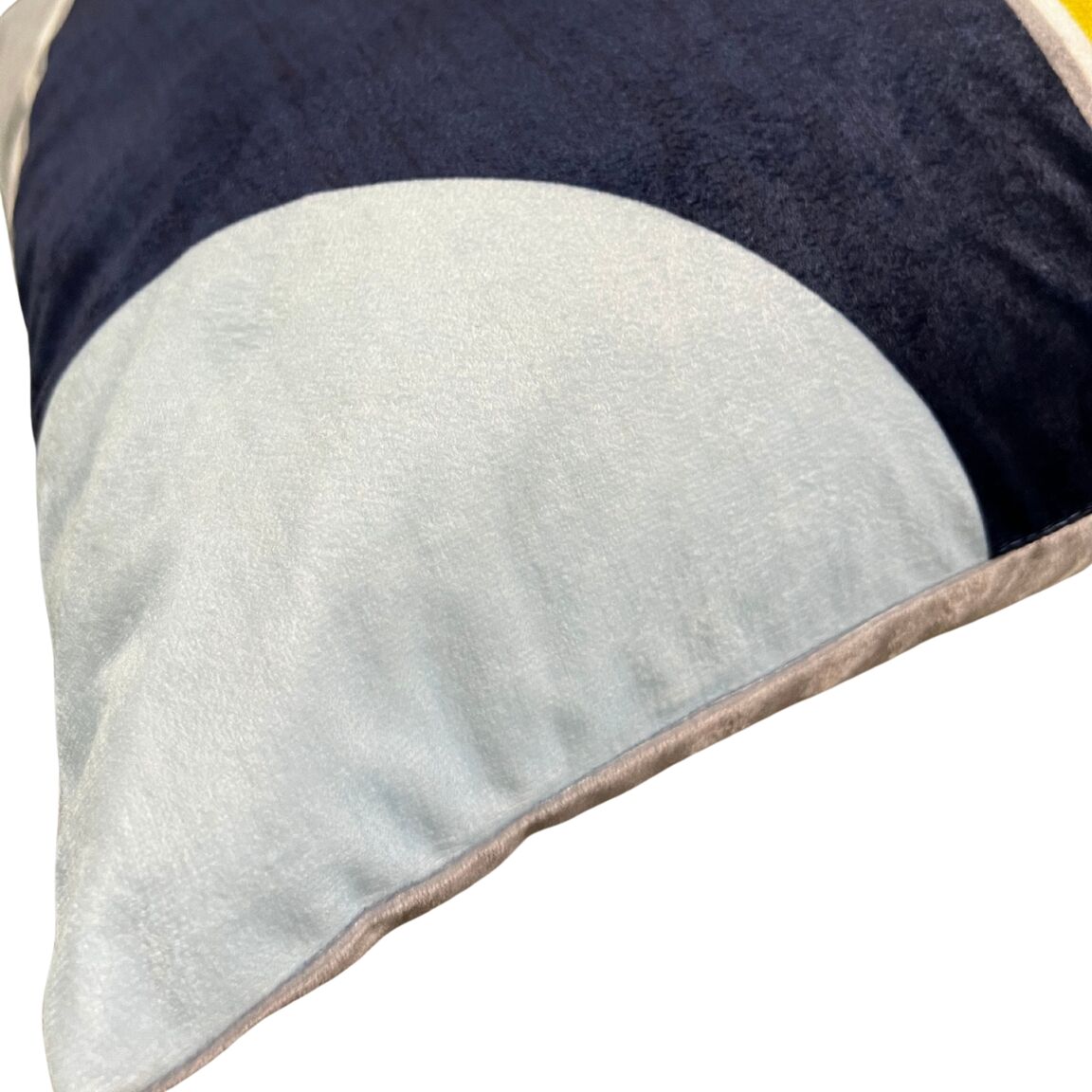 One side corner of the multicolored cushion cover