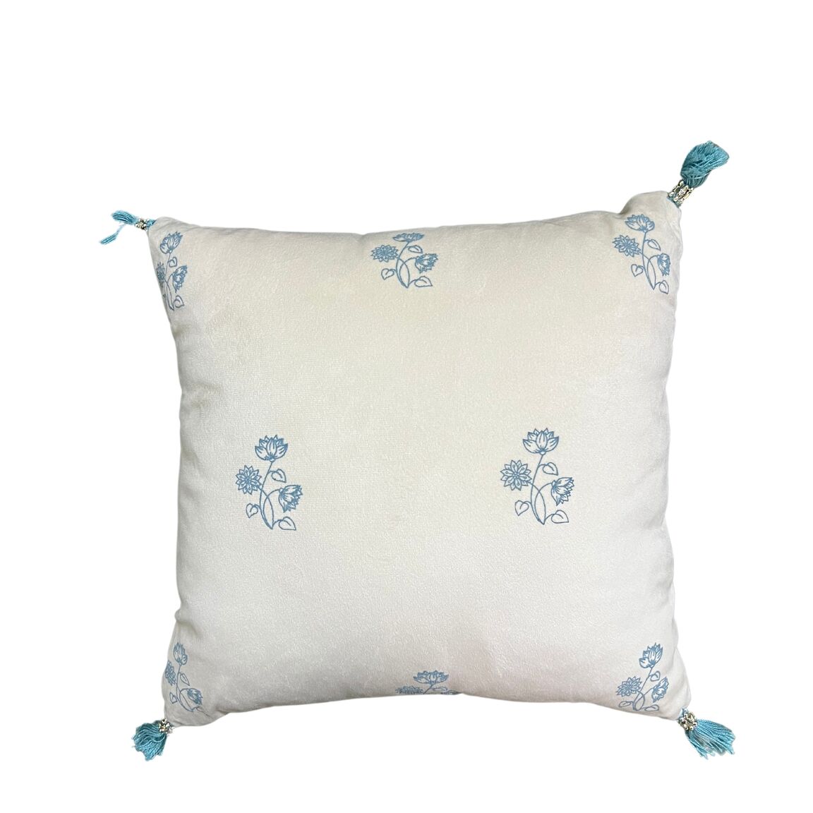 Offwhite velvet cushions with the floral design cushion cover along with tassle