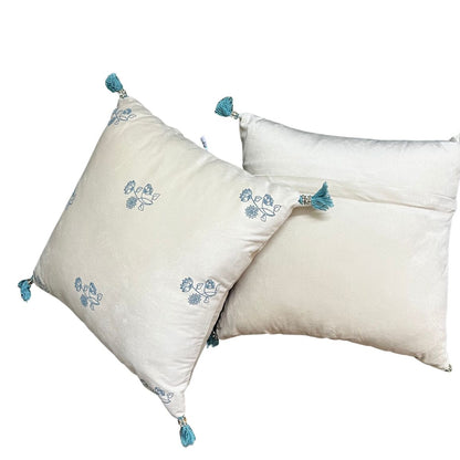 Two velvet offwhite cushion with floral design and tassles