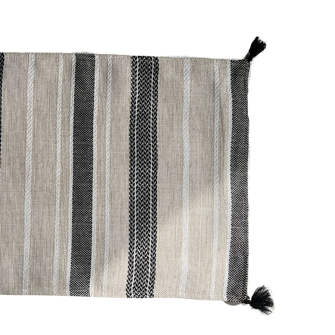 A bold striped place mat with with black tassles