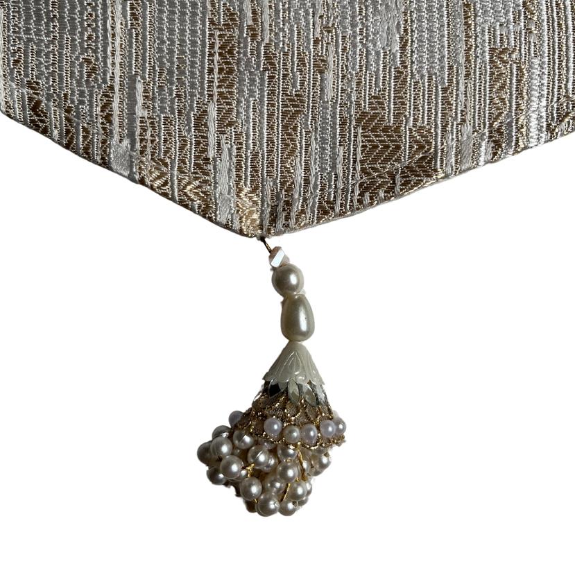 A closer look to the smooth silk lining and charming tassels on the silk runner