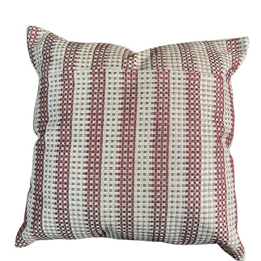 A brick red and ivory stripped cushion cover from the back