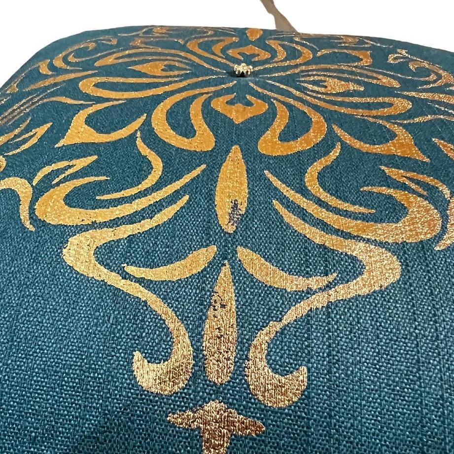 A close up from the side of the Teal cushion cover